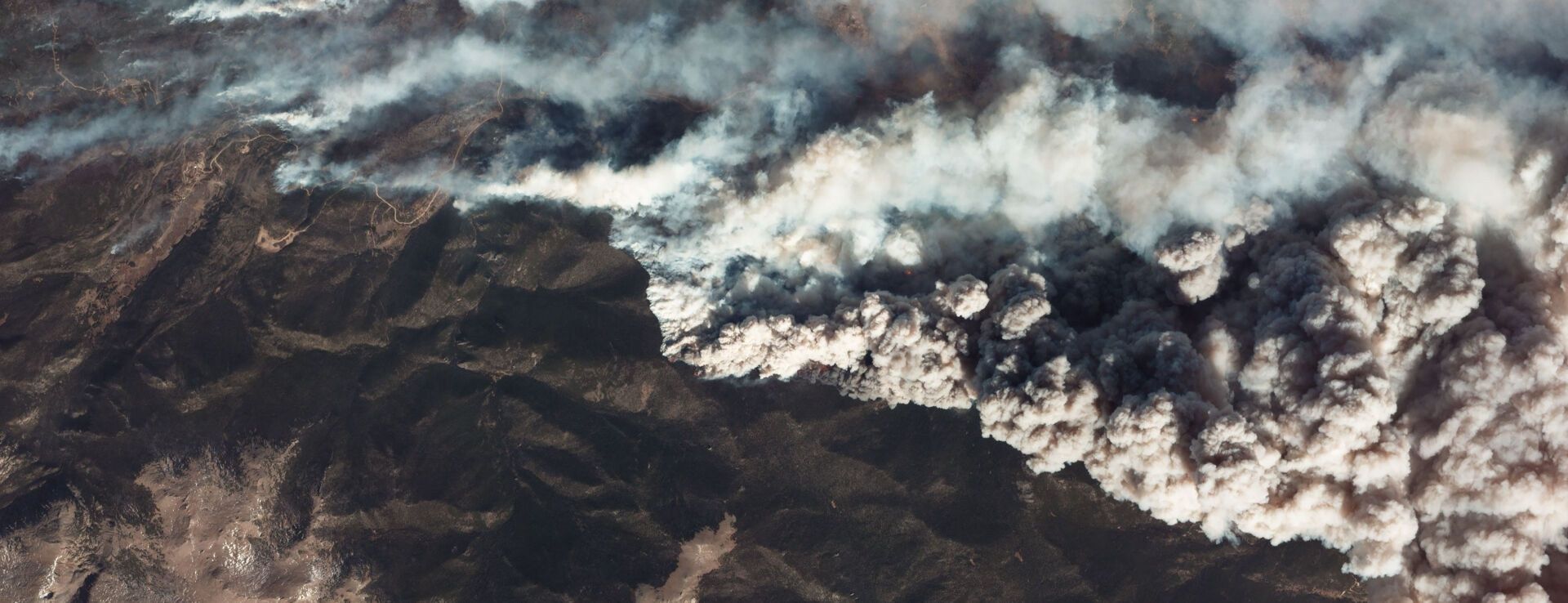 Wildfire smoke across a mountain range