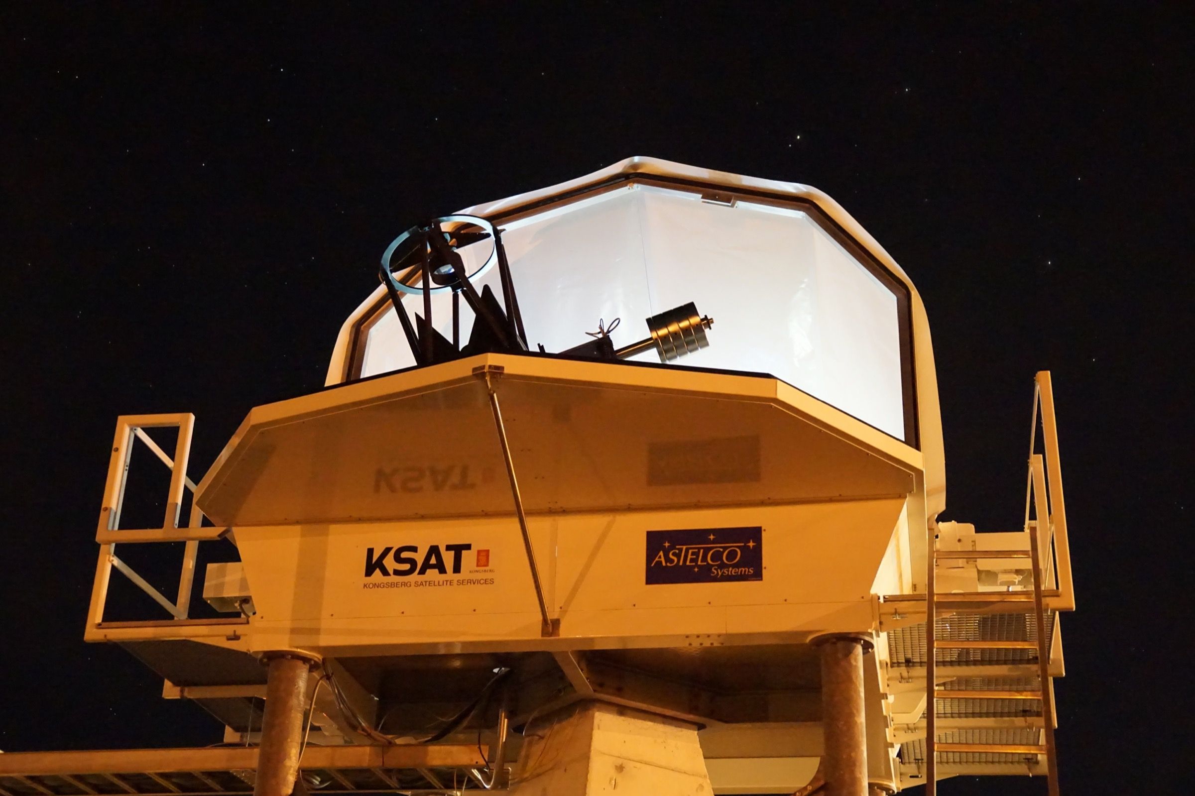KSAT optical ground station at Nemea at night, telescope exposed