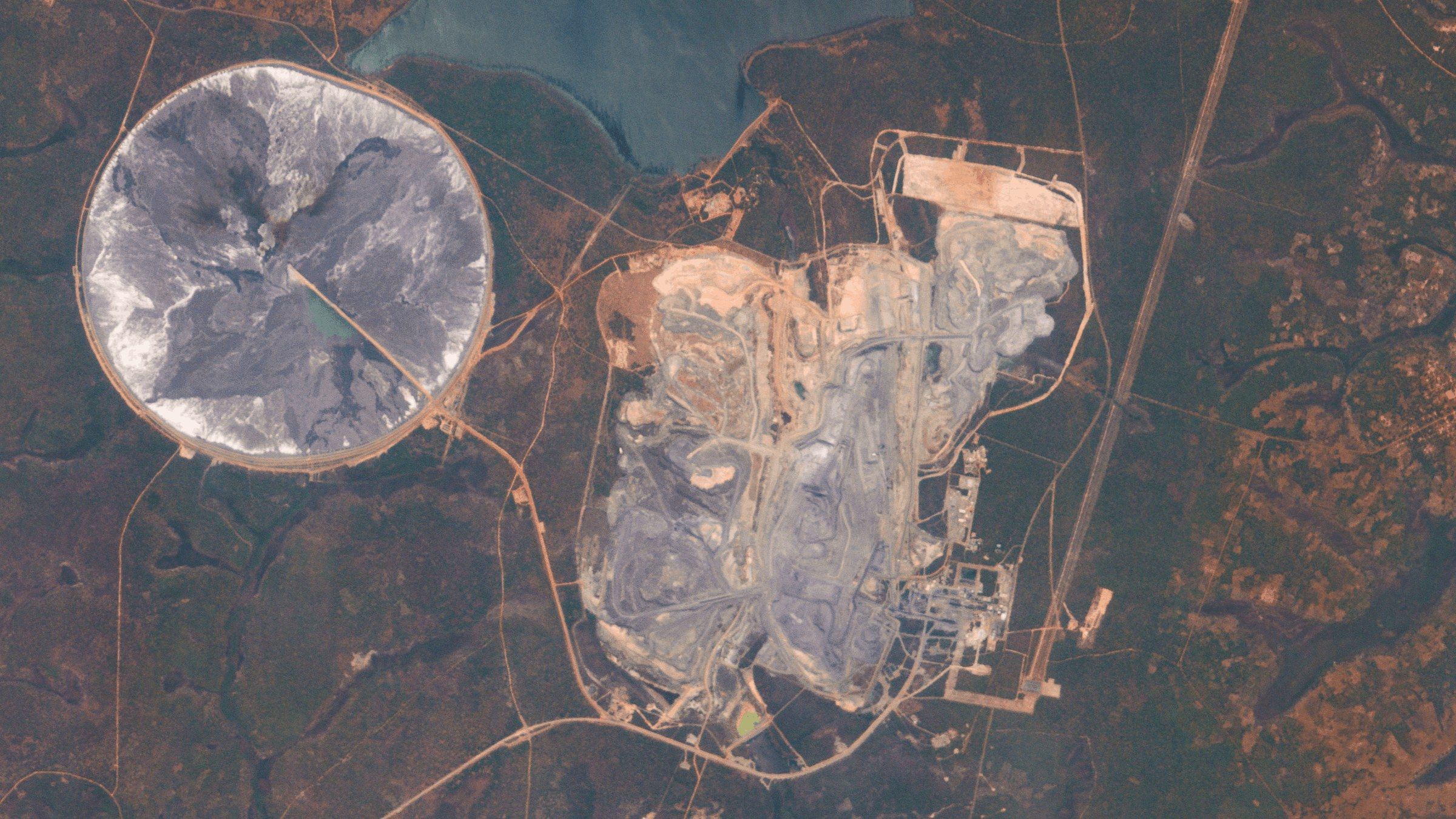Tailings pond beside an open pit