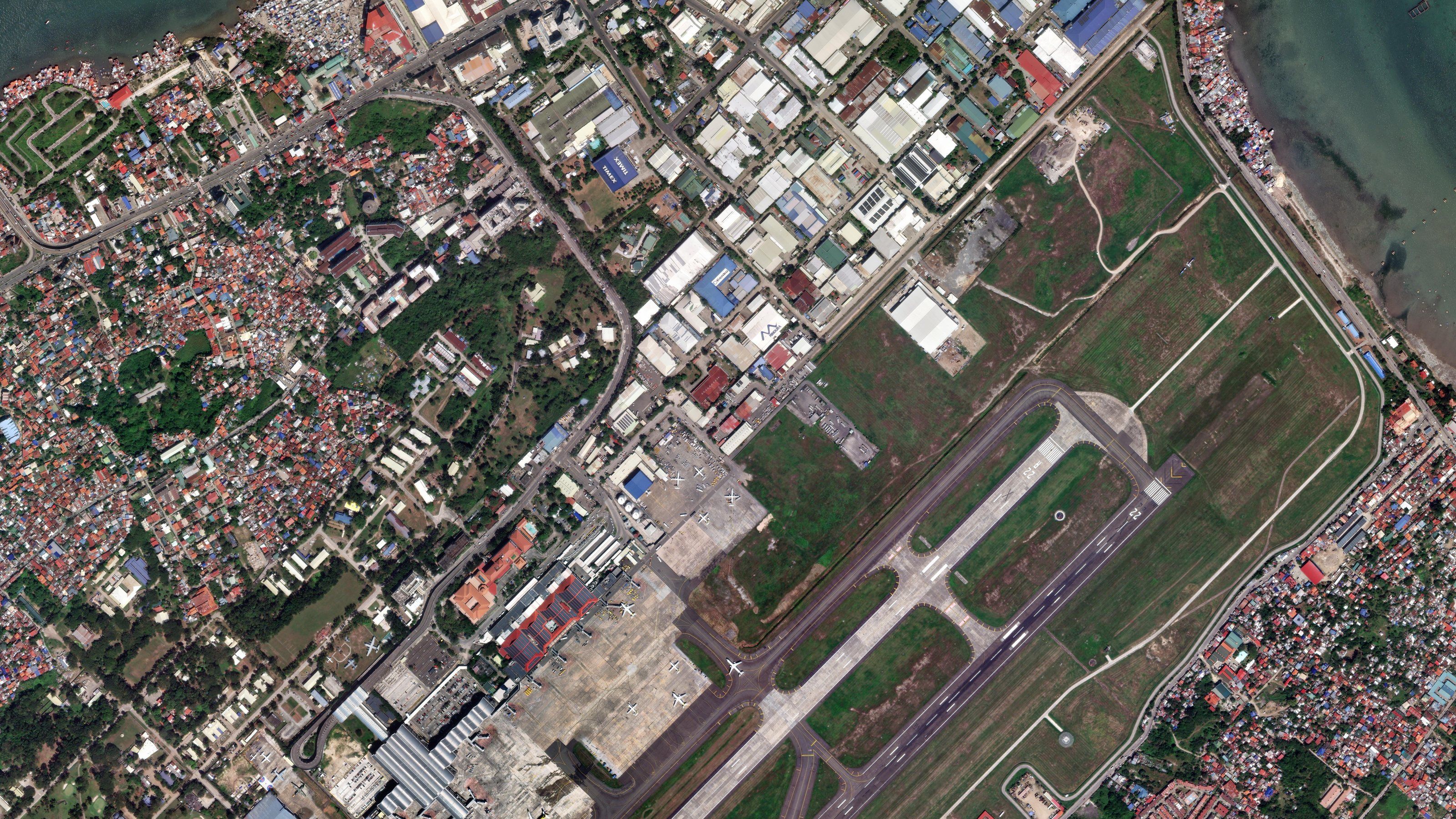 Airport runway and surrounding town at 31 cm